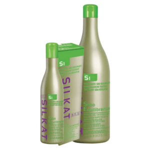 Two green bottles and a matching box of BES Silkat Dermatological shampoo are displayed, featuring product labels in purple and green text.