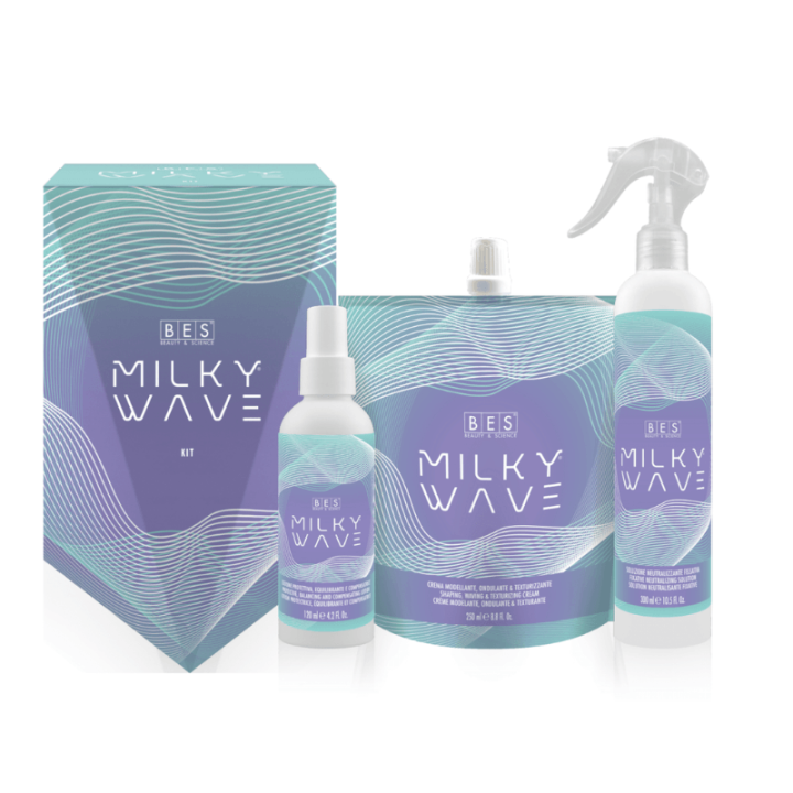 The Milky Wave Try Me Kit features four hair product containers—a spray bottle, pump bottle, pouch, and a branded box—each decorated with blue and purple wave designs.